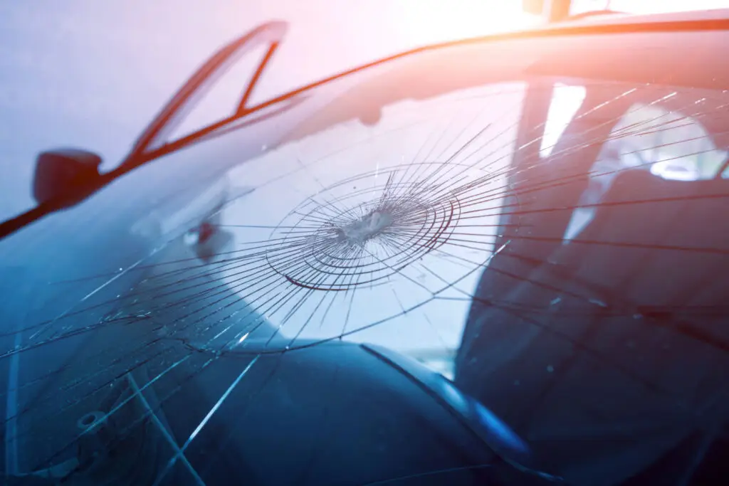 A cracked windshield indicating the need for auto glass replacement