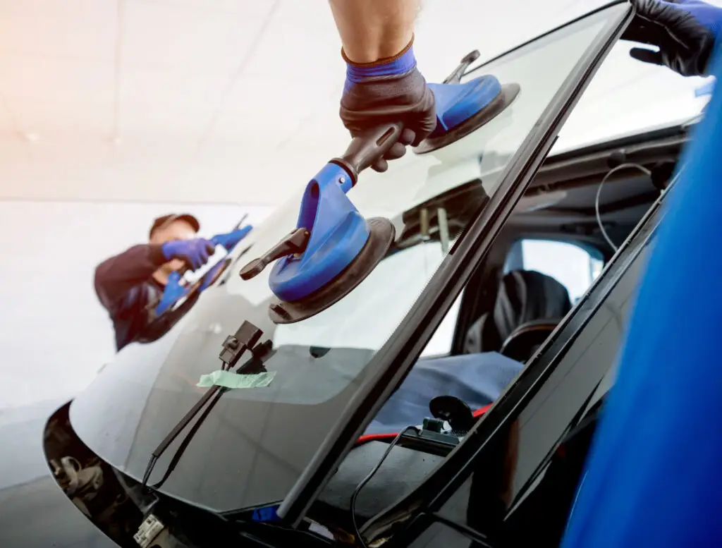 Local auto glass shop with technicians at work